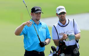 Holmes leads Doral WGC after ace