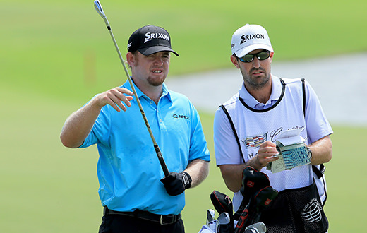 Holmes leads Doral WGC after ace