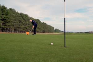 Gary Nicol hits a putt with Trackman