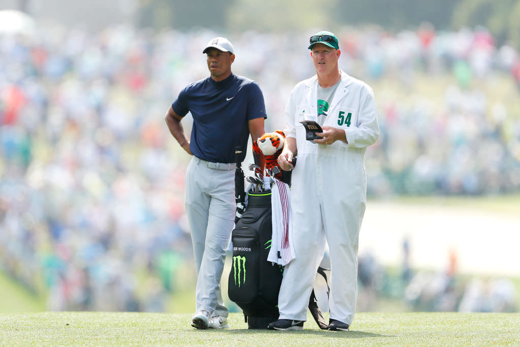 Why do caddies wear white jumpsuits at The Masters