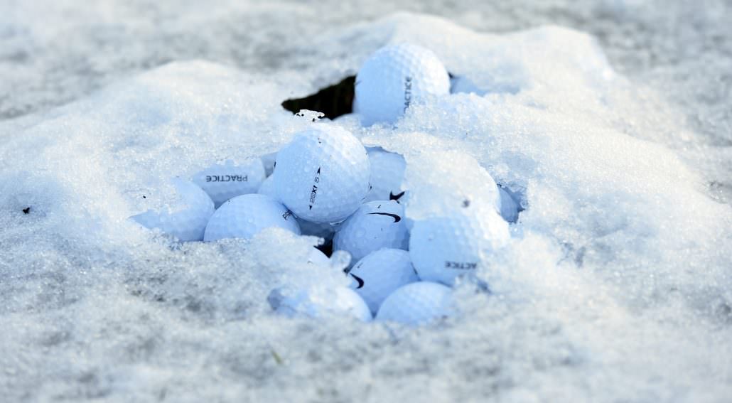 How does cold weather affect golf balls
