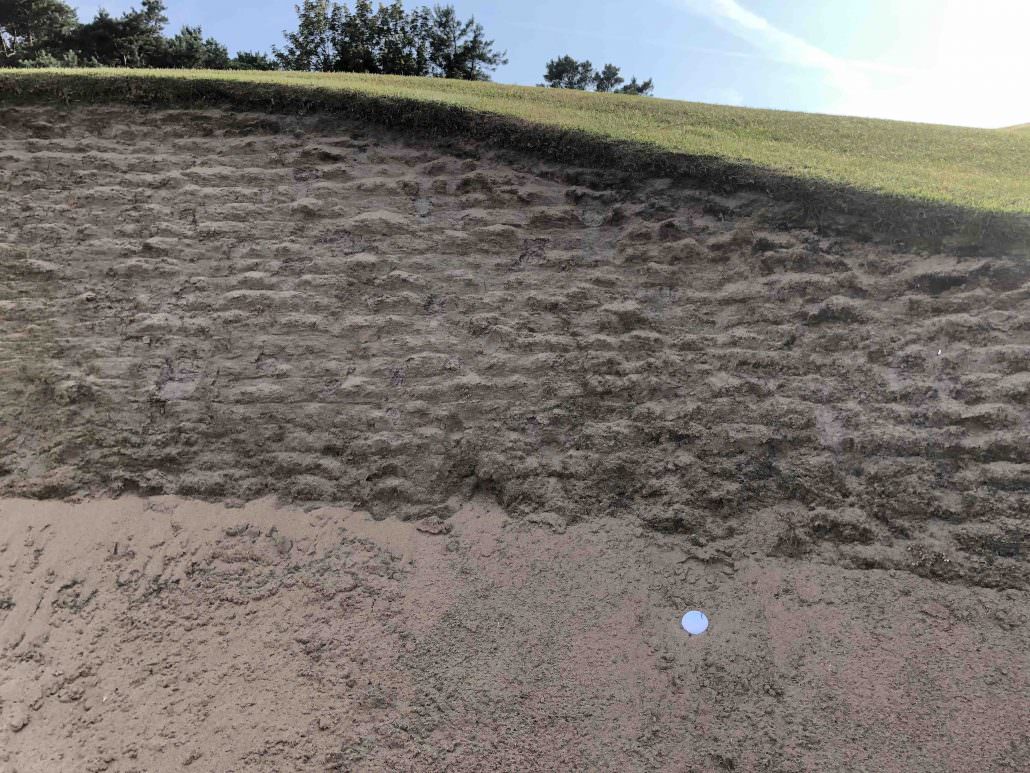 golf ball in a bunker