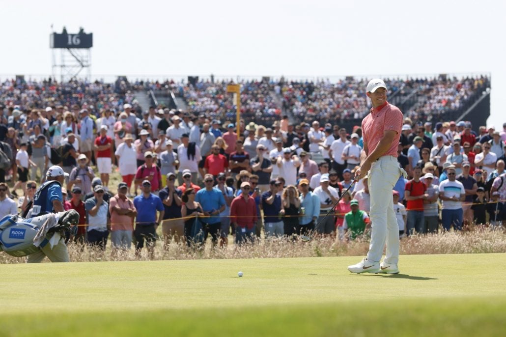 Rory McIlroy putts in front of fans at The Open at Royal St George's | Source: Getty Images
Can spectators give advice in golf