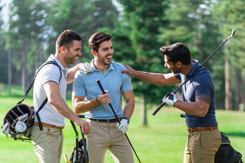 Golfers talking on a tee box
