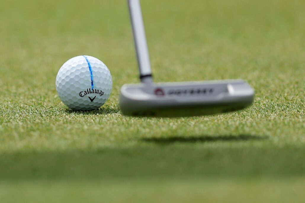 ball hits ball on green