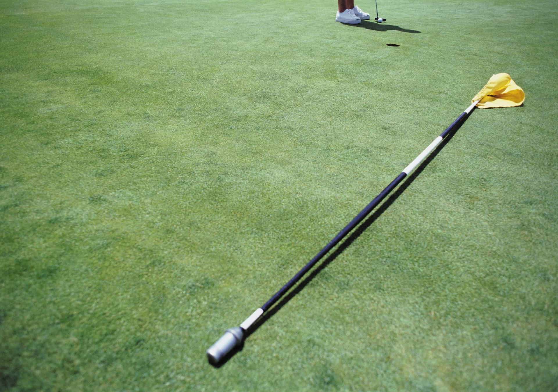 Golf flagstick rules Can you leave a pin that hasn't been replaced?
