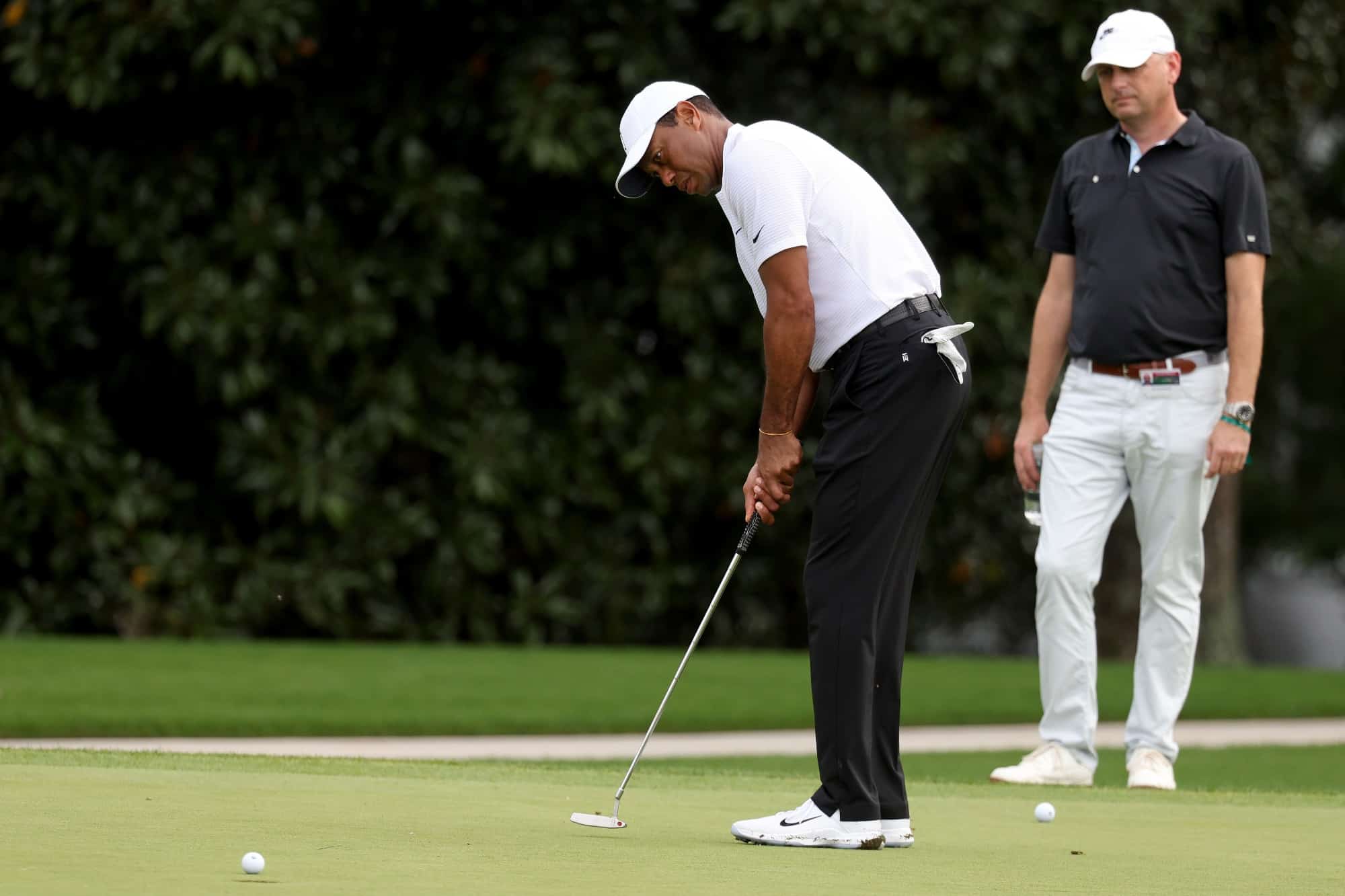 Who is Tiger Woods' caddie?