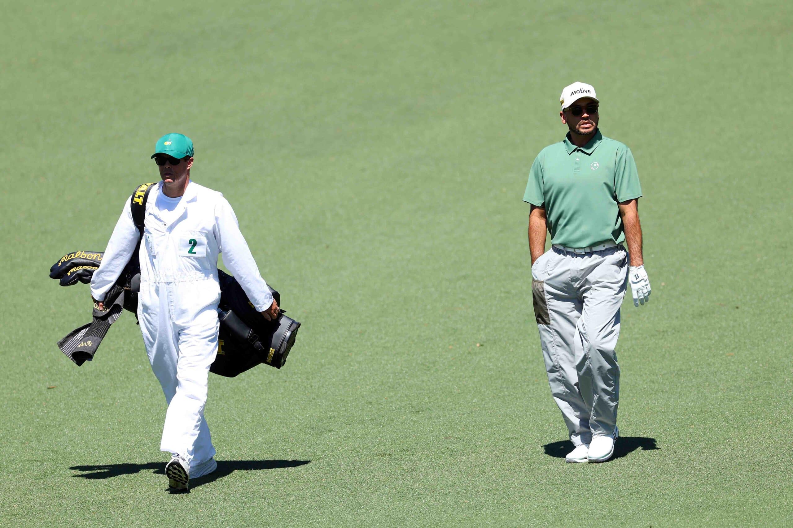 why do caddies wear white jumpsuits