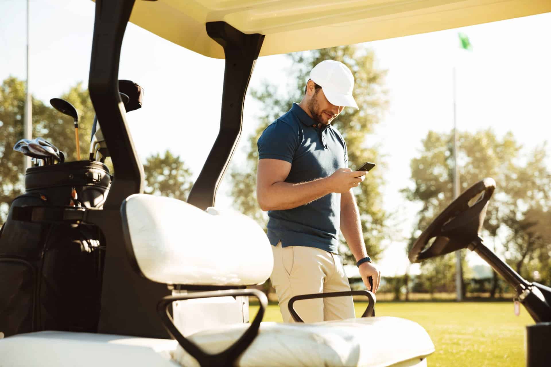 A player looks at their phone on the course | Source: Supplied golf technology
