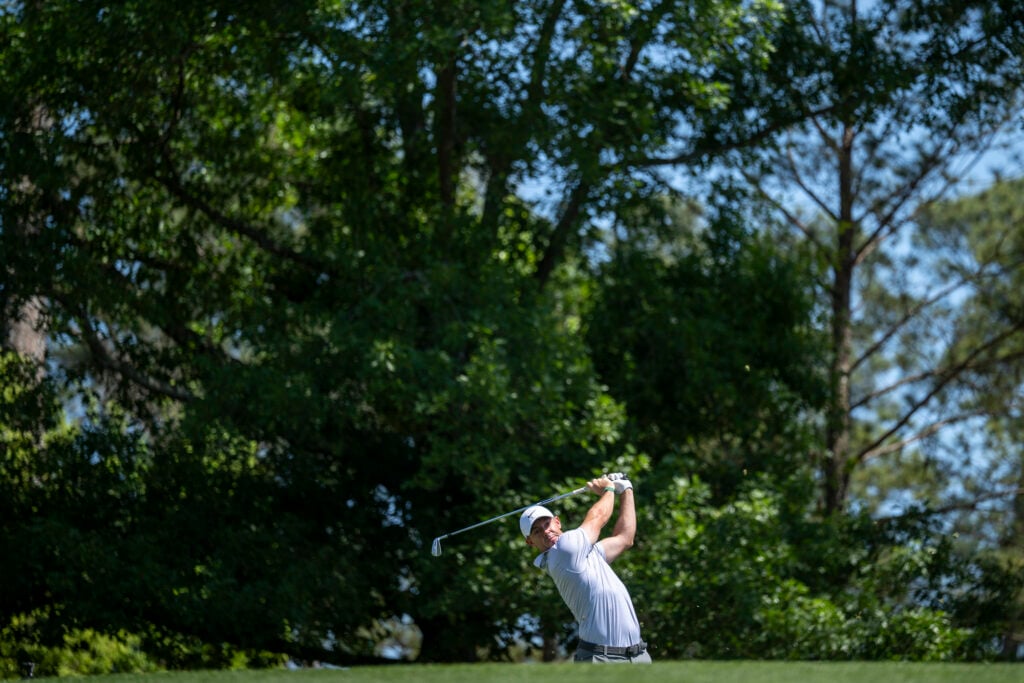 Masters champion Rory McIlroy of Northern Ireland plays a stroke from the No. 4 tee during the second round of the Masters at Augusta National Golf Club, Friday, April 10, 2026.