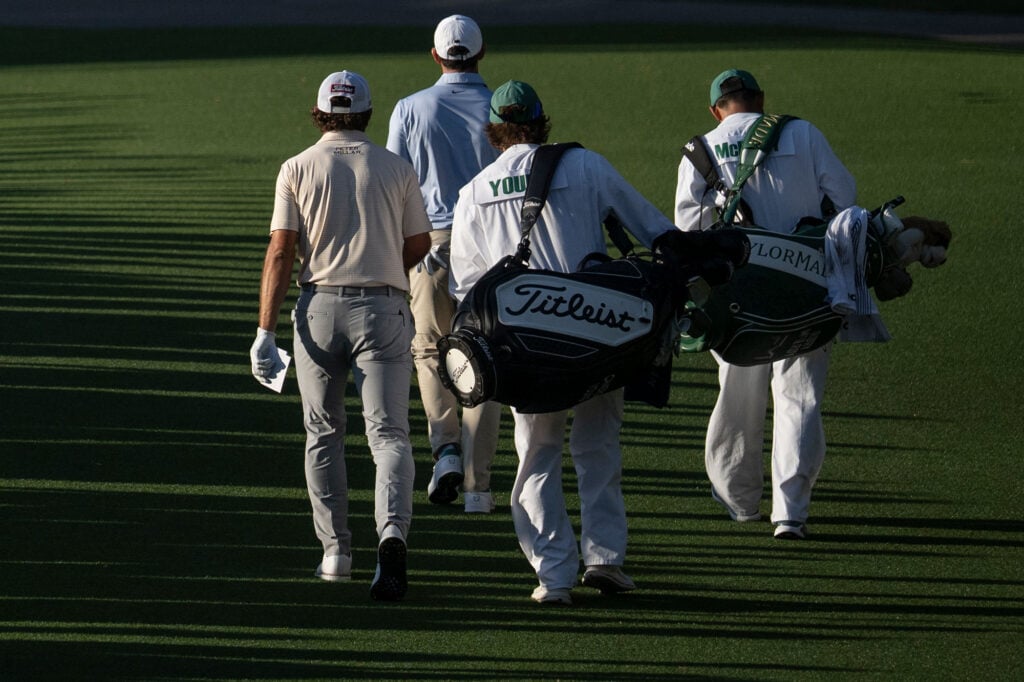 Cameron Young and Rory McIlroy walk off the tee box on the No. 18 hole. | Source: Joel Marklund