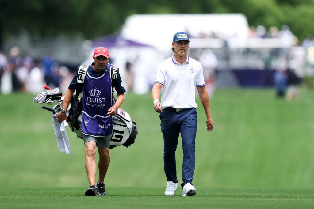 Kristoffer Reitan of Norway and his caddie walk the 10th hole during the first round of the Truist Championship 2026 at Quail Hollow Country Club on May 07, 2026 in Charlotte, North Carolina. | Source: Andrew Redington/Getty Images
