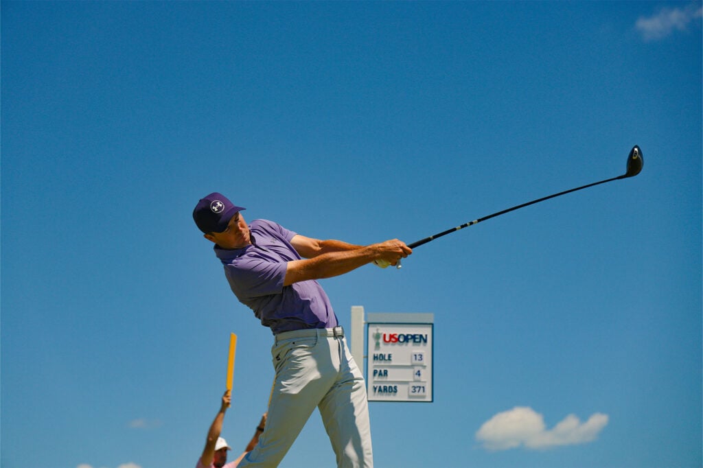 Jordan Spieth plays his tee shot on the 13th hole during the third round of the 2026 U.S. Open at Shinnecock Hills Golf Club in Southampton, N.Y. on Saturday, June 20, 2026 | Source: USGA/Jeff Haynes