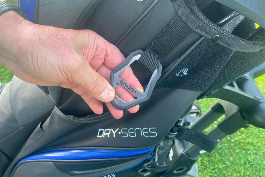 Close-up of waterproof golf trolley bag with Dry-Series logo and secure clip.