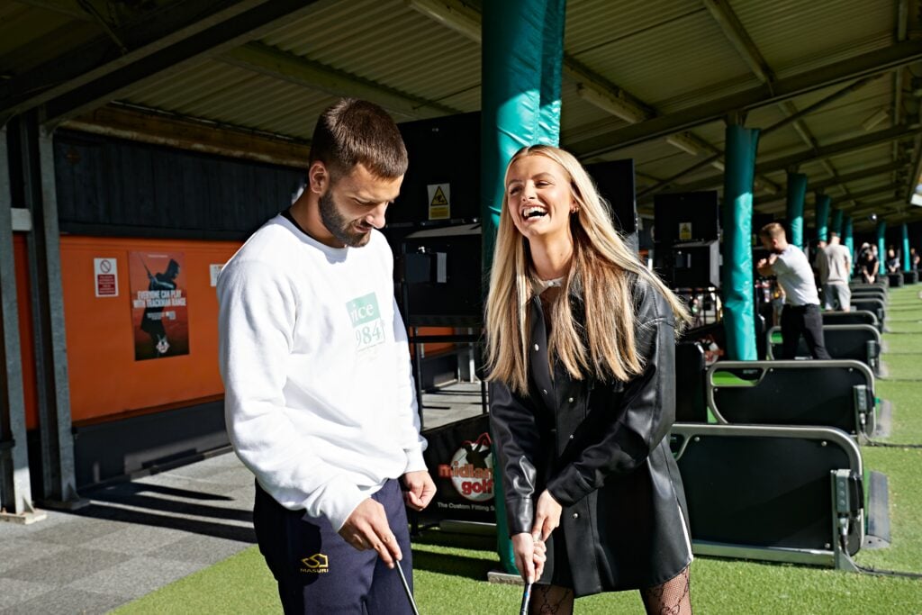 Golfers having fun at a driving range | Source: England Golf