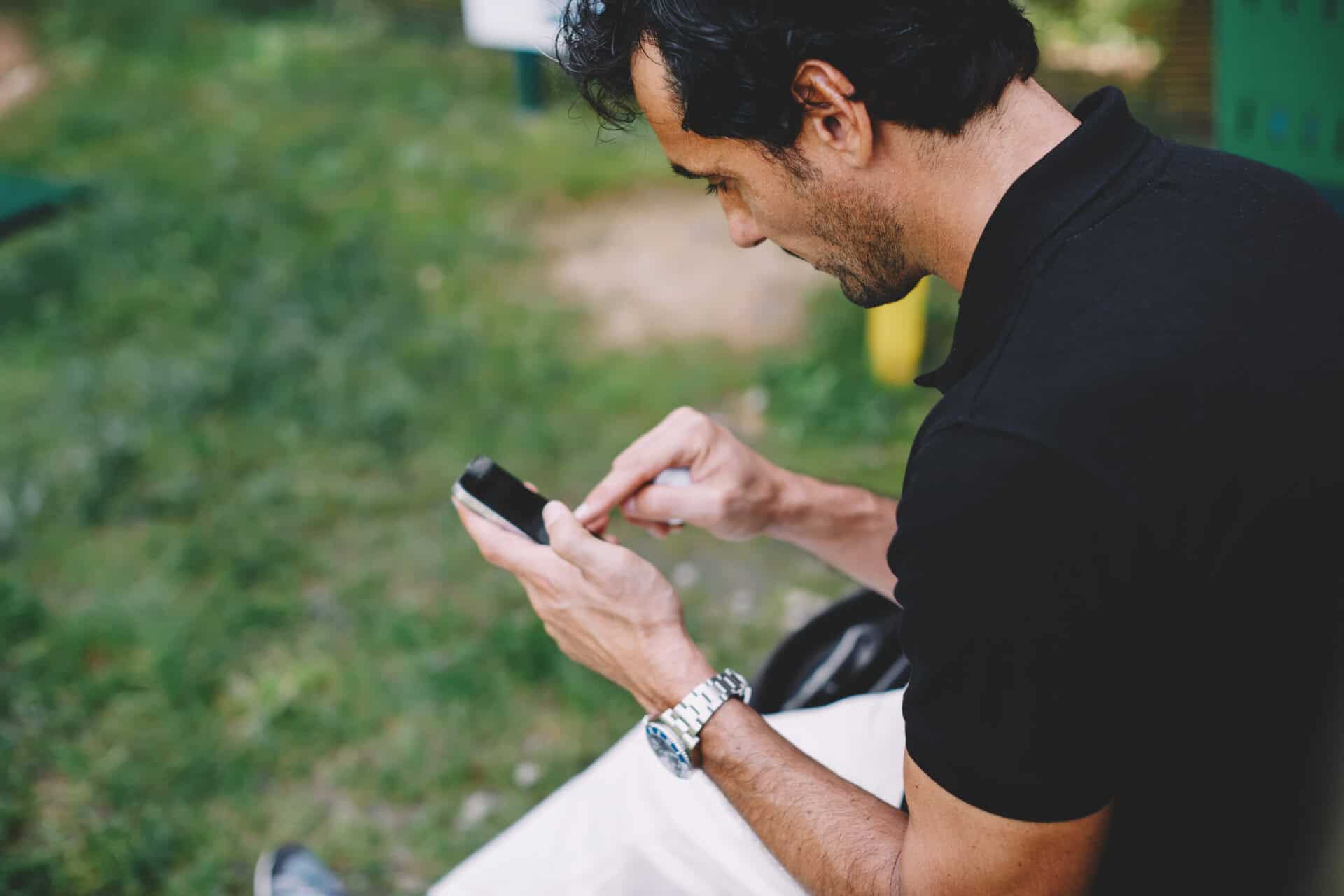 Golfer on their mobile phone | Source: Adobe Stock