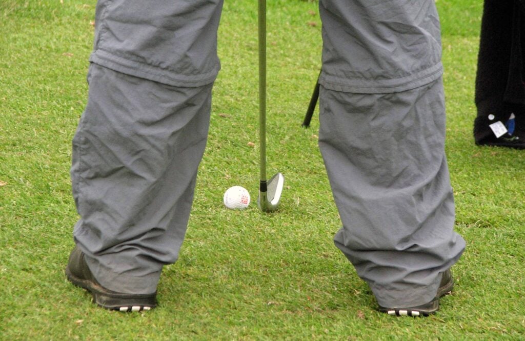 A golfer prepares to take a shot | Source: Adobe Stock ball moved golf rule