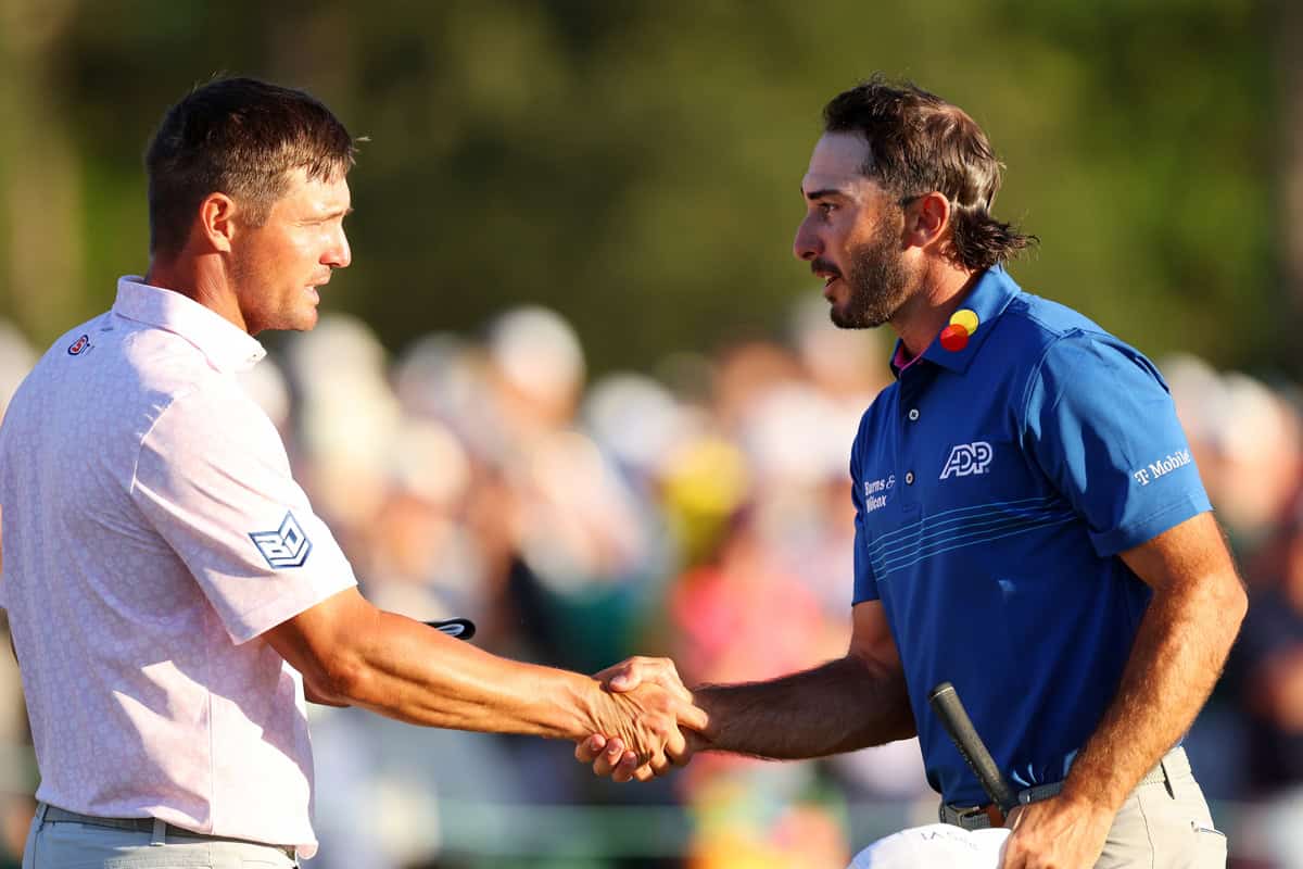 AUGUSTA, GEORGIA - APRIL 13: Bryson DeChambeau of the United States (L) and Max Homa of the United States shake hands on the 18th green after finishing their round during the third round of the 2024 Masters Tournament at Augusta National Golf Club on April 13, 2024 in Augusta, Georgia. (Photo by Andrew Redington/Getty Images)