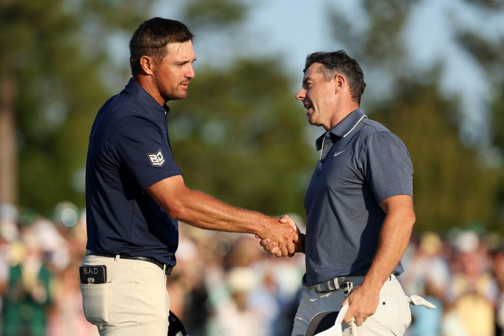 Rory McIlroy shakes hands with Bryson DeChambeau during the final round of the 2025 Masters Tournament | Source: Richard Heathcote/Getty Images