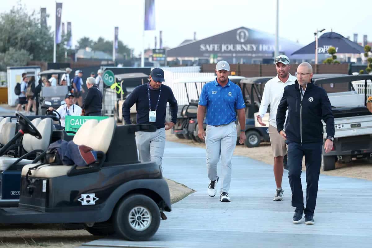 SOUTHPORT, ENGLAND - JULY 17: Bryson DeChambeau of the United States speaks with a rules official following day two of the The 154th Open Championship at Royal Birkdale on July 17, 2026 in Southport, England. (Photo by Michael Reaves/Getty Images)