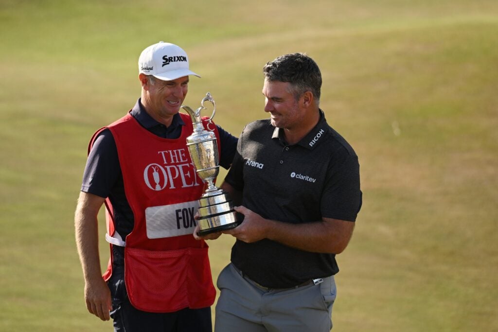 Ryan Fox of New Zealand poses with the Claret Jug and caddie Dean Smith following victory during Day Four of the The 154th Open Championship at Royal Birkdale on July 19, 2026 in Southport, England. (Photo by Charlie Crowhurst/R&A/R&A via Getty Images)