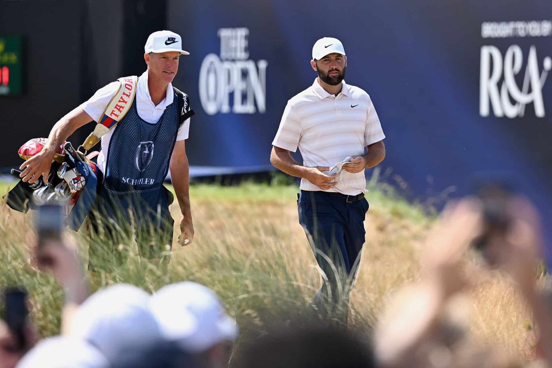 Scottie Scheffler of the United States walks with his caddie Ted Scott on the first hole during Day Four of the The 154th Open Championship at Royal Birkdale on July 19, 2026 in Southport, England. (Photo by Stuart Kerr/R&A/R&A via Getty Images)