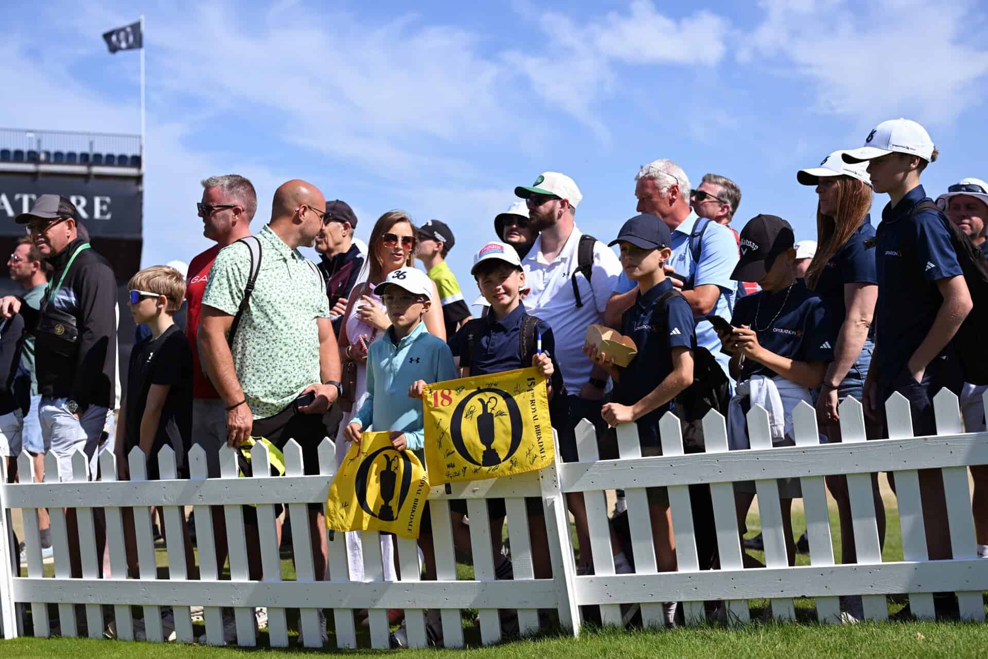 Young fans hold signed pin flags prior to The 154th Open Championship at Royal Birkdale on July 13, 2026 in Southport, England. (Photo by Stuart Kerr/R&A/R&A via Getty Images)