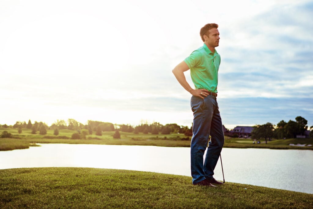 A golfer in reflective mood on the course | Source: Adobe Stock