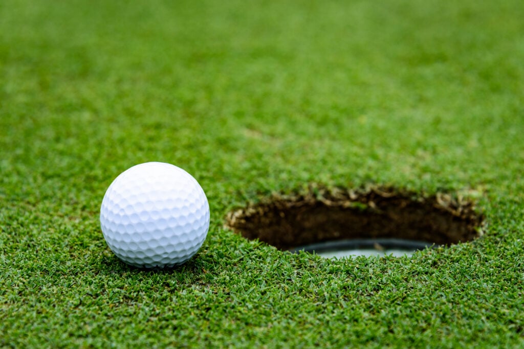 What happens if a ball hits the bottom of the hole but bounces out? | Source: Adobe Stock