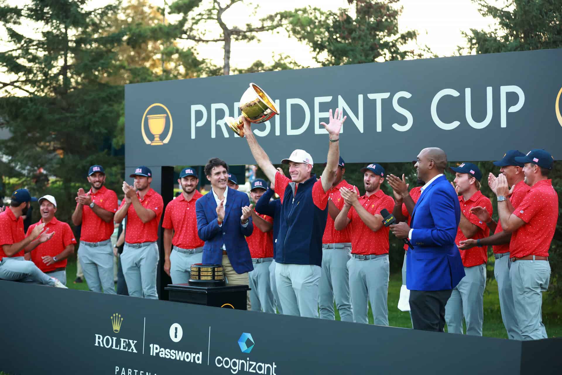 MONTREAL, QUEBEC - SEPTEMBER 29: U.S. Team Captain Jim Furyk celebrates after being presented the Presidents Cup Trophy by Canadian Prime Minister Justin Trudeau during Sunday Singles on day four of the 2024 Presidents Cup at The Royal Montreal Golf Club on September 29, 2024 in Montreal, Quebec, Canada. (Photo by Vaughn Ridley/Getty Images)