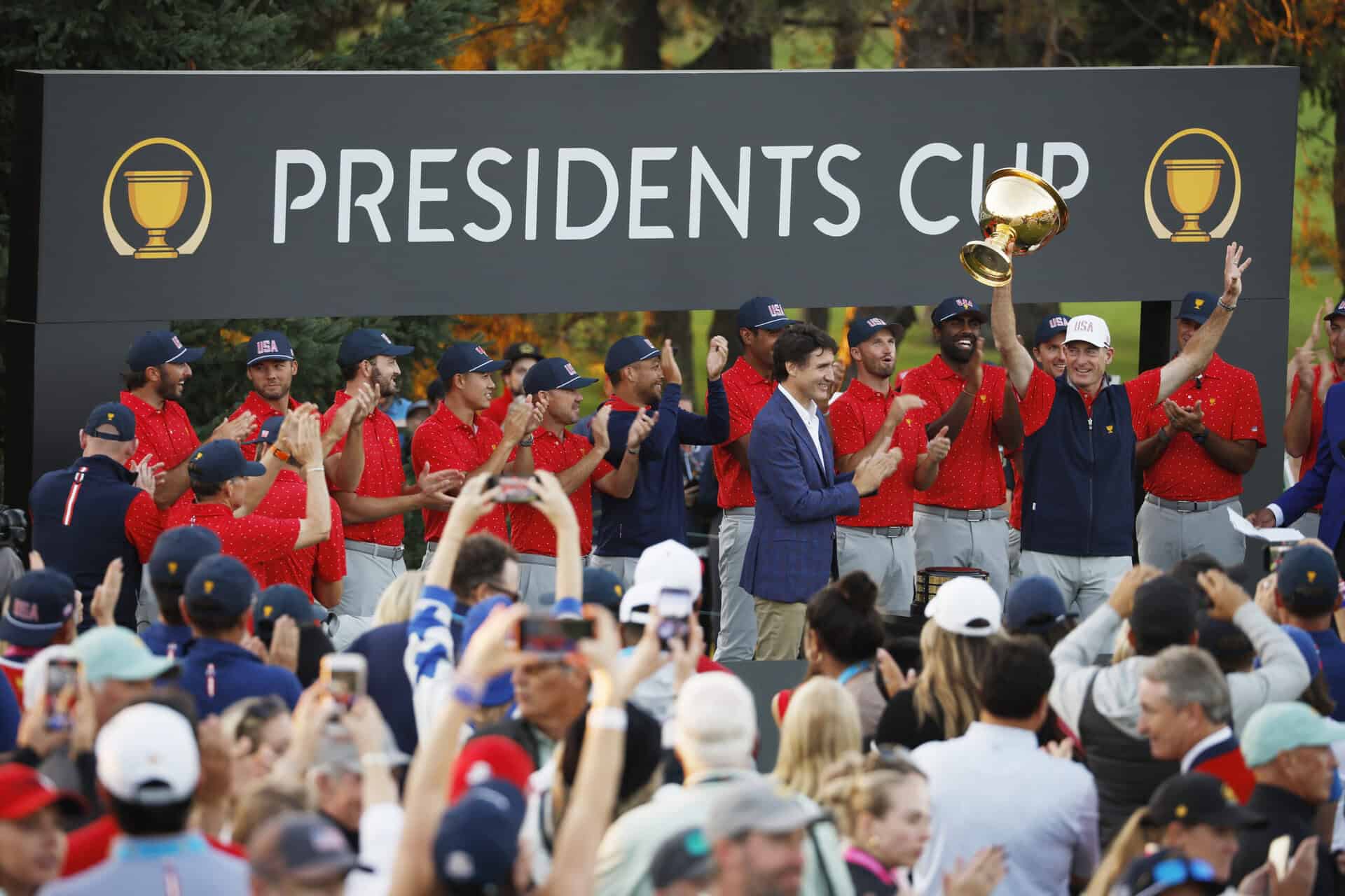 MONTREAL, QUEBEC - SEPTEMBER 29: U.S. Team Captain Jim Furyk celebrates after being presented the Presidents Cup Trophy by Canadian Prime Minister Justin Trudeau on day four of the 2024 Presidents Cup at The Royal Montreal Golf Club on September 29, 2024 in Montreal, Quebec, Canada. (Photo by Cliff Hawkins/Getty Images)