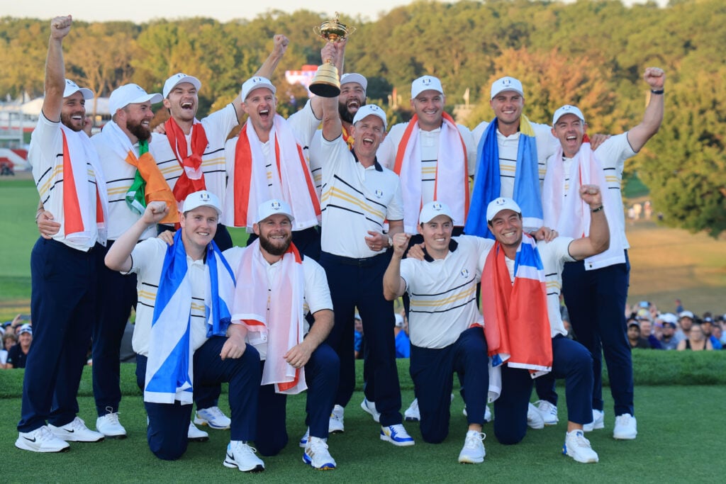 Team Europe hold the Ryder Cup trophy after their 15-13 victory during the trophy presentation ceremony following the Sunday singles matches of the 2025 Ryder Cup | Source: David Cannon/Getty Images