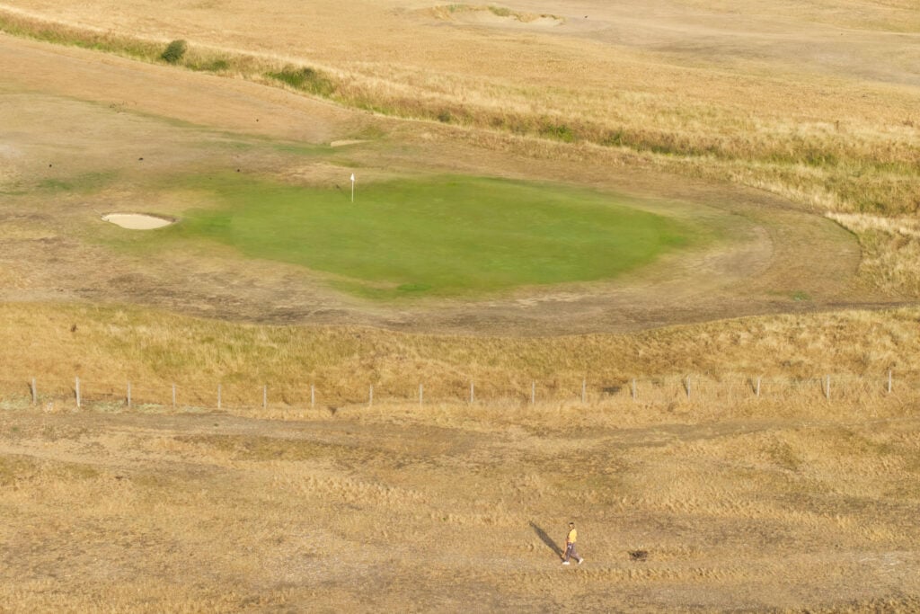 An aerial view of a parched golf course beside the beach in St. Marys Bay, England | Source: Getty Images
UK golf drought