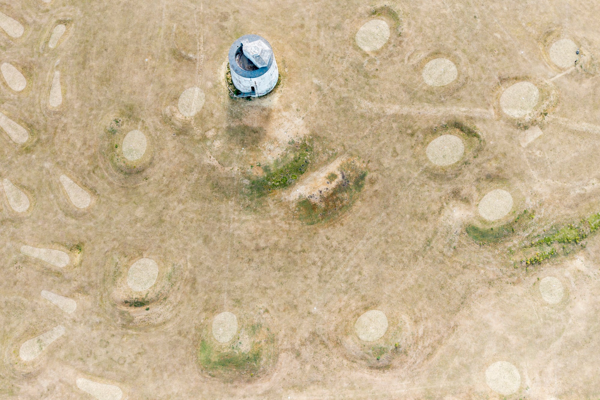 An aerial view of a parched pitch and put golf course beside the beach on August 17, 2026, in Folkstone, England | Source: Getty Images