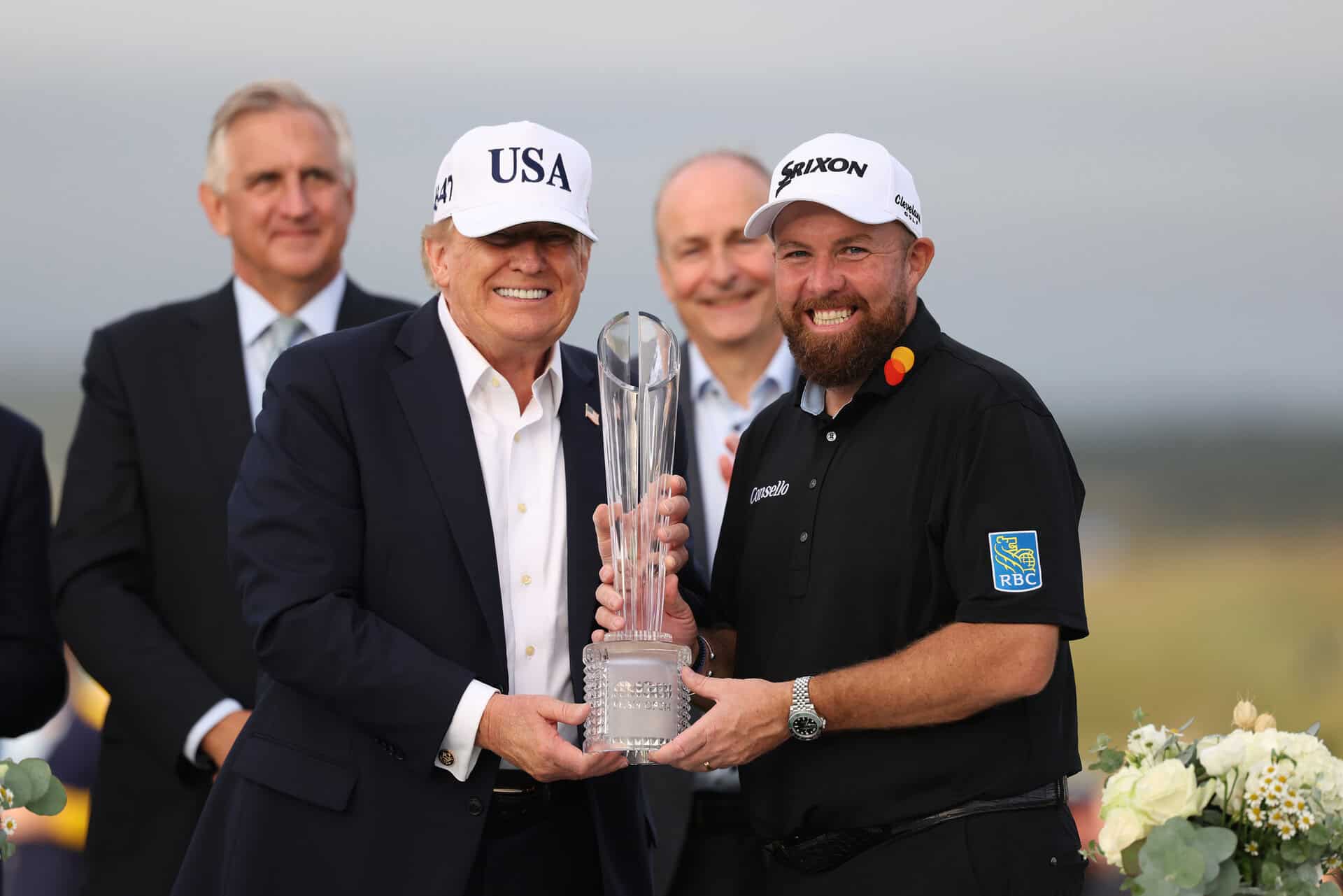 DOONBEG, IRELAND - SEPTEMBER 13: U.S. President Donald Trump and Amgen Irish Open winner Shane Lowry of Ireland pose with the trophy on day four of the Amgen Irish Open at Trump International Golf Links in Doonbeg on September 13, 2026 in Doonbeg, Ireland. (Photo by Richard Heathcote/Getty Images)