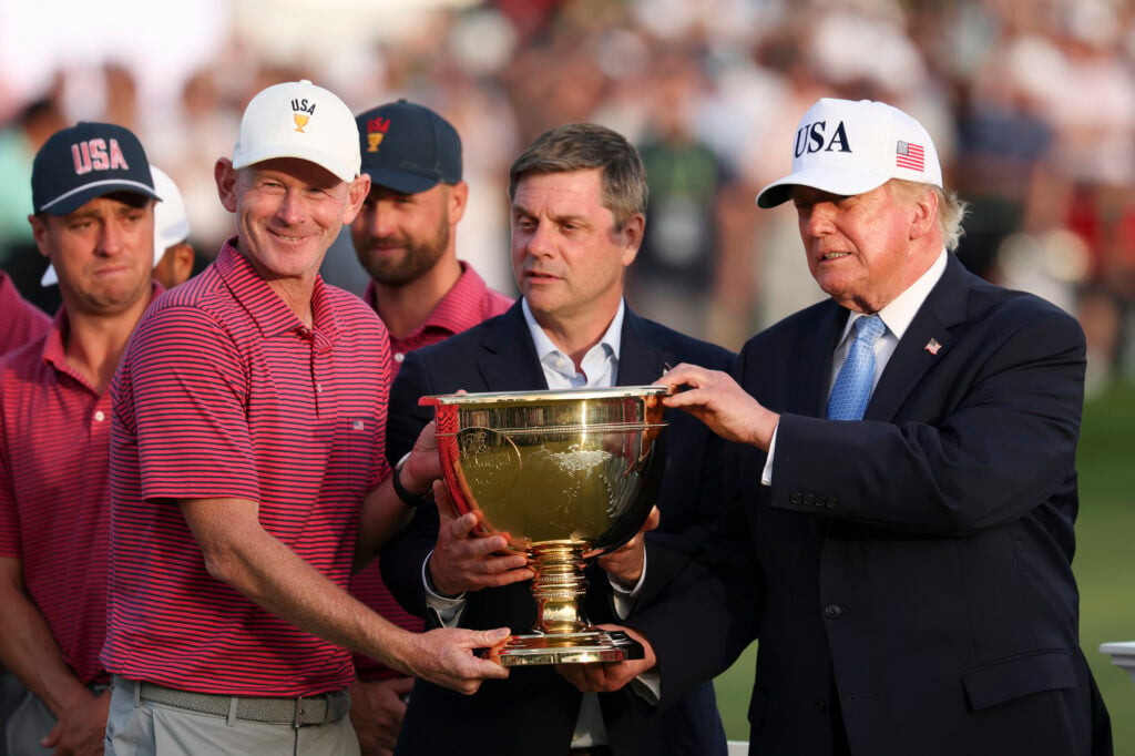 Captain Brandt Snedeker of the U.S. Team lifts the trophy with President Donald Trump | Source: Luke Hales/Getty Images