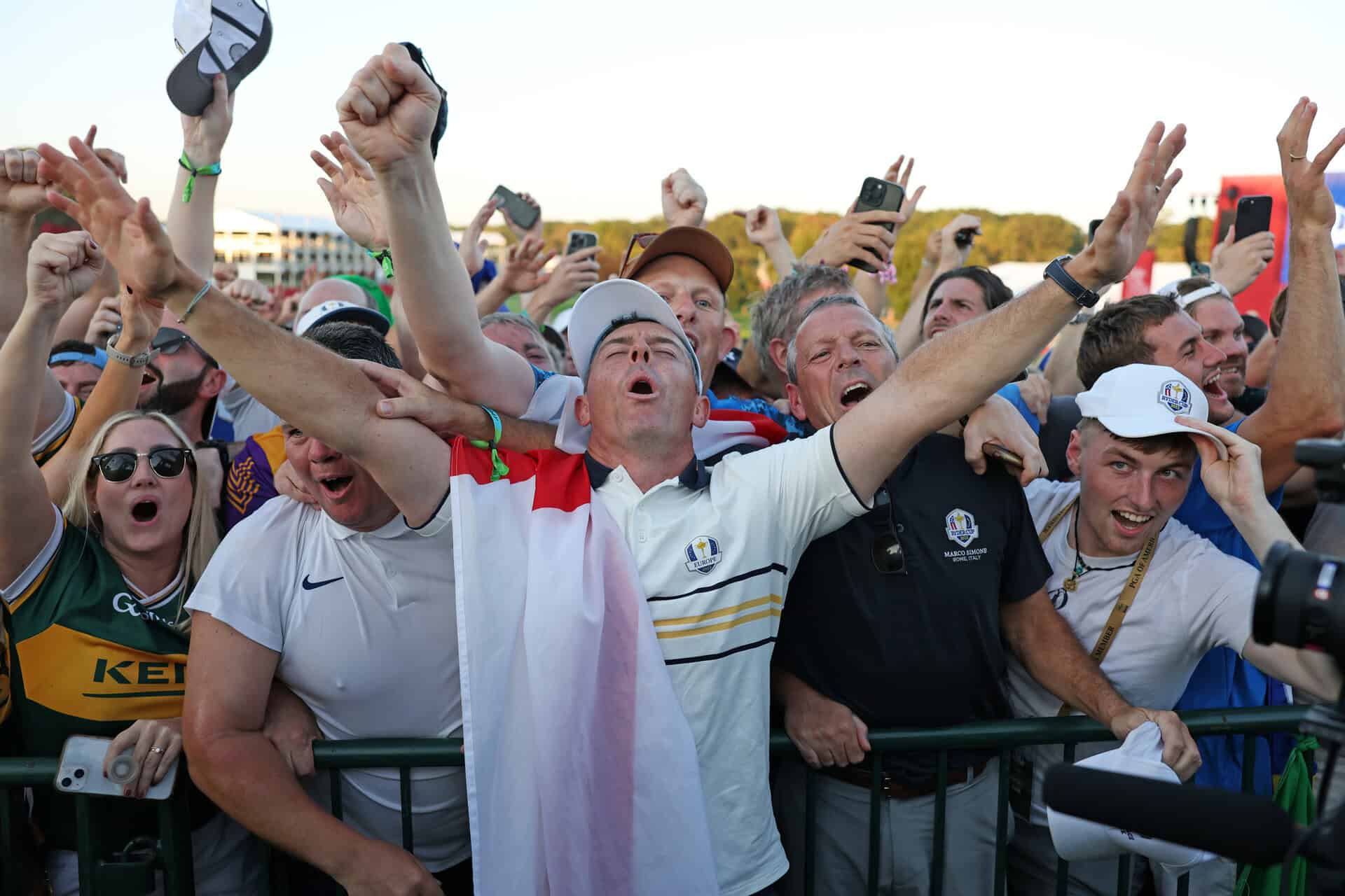 FARMINGDALE, NEW YORK - SEPTEMBER 28: Rory McIlroy of Team Europe celebrates with fans after Team Europe's 15-13 win over Team United States during the Sunday singles matches of the 2025 Ryder Cup at Black Course at Bethpage State Park Golf Course on September 28, 2025 in Farmingdale, New York. (Photo by Richard Heathcote/Getty Images)